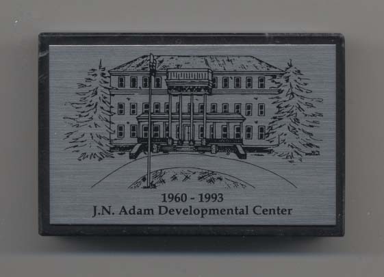 J. N. Adam Developmental Center paperweight, a souvenir of the 1993 closure ceremony.